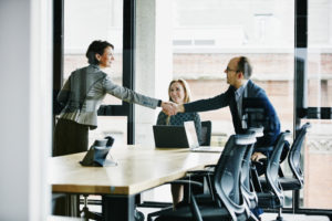 Businesspeople shaking hands before meeting