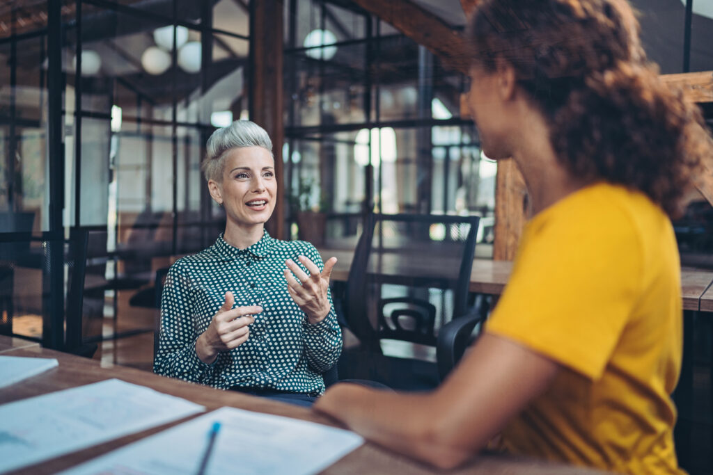 Women speaking about learning opportunities in the company. 